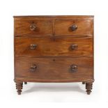 A Victorian mahogany bow fronted chest of two short and two long graduated drawers on turned feet,