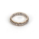 A yellow and white metal full eternity ring set paste,