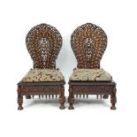 A pair of Anglo-Indian hardwood and mother of pearl inlaid side chairs, the low seats with carved