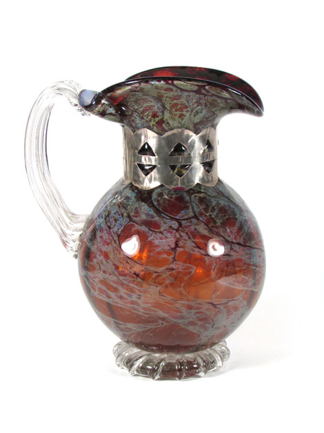 A modern metalware mounted mottled and clear glass jug by Anthony Stern, etched signature to base,