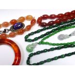 A group of jade and other beaded necklaces and other items of jewellery