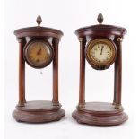 A pair of Edwardian mahogany and gilt metal clock cases of Neo-Classical form, one containing a