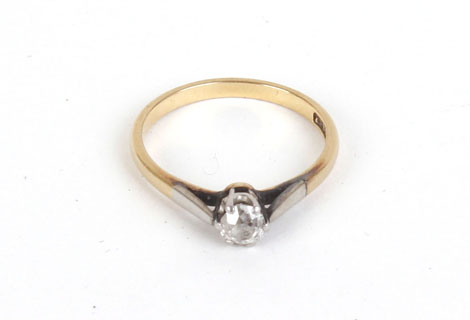 An 18ct yellow gold ring set single diamond in a raised setting, approx. 0.