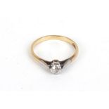 An 18ct yellow gold ring set single diamond in a raised setting, approx. 0.