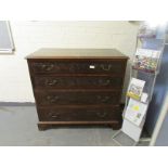 A George II and later carved oak chest of four long graduated drawers on bracket feet, w. 110 cm