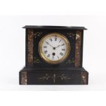 A late 19th century French mantle clock, the enameled face with Roman numerals within a black