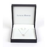 An 18ct white gold fine chainlink necklace suspending an 18ct pendant set single diamond,