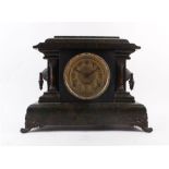 A late 19th century mantle clock striking on a gong and a bell, the face with Arabic numerals within