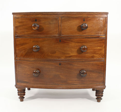 A Victorian mahogany bow fronted chest of two short and two long graduated drawers on turned feet, - Image 2 of 2