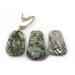 A group of three carved jade pendants predominately depicting birds, max l. 5.