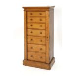 A 19th century oak Wellington-type chest of seven drawers, w. 60 cm CONDITION REPORT: Losses to