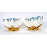 A pair of Coalport shell shaped table centres, gilt decorated on naturalistic coral bases, h. 11