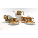 A modern Noritake six sitting coffee service gilt decorated with orange bands CONDITION REPORT: