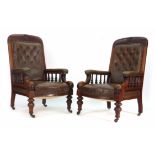 A pair of Victorian mahogany and button upholstered club armchairs on turned feet  CONDITION REPORT: