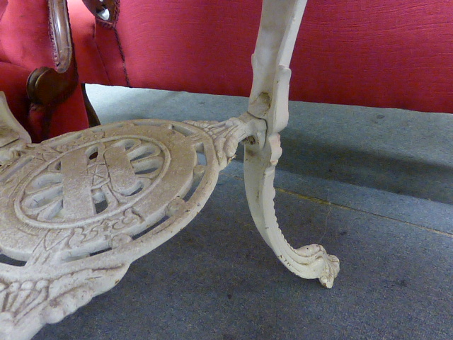 A late Victorian garden table, the mahogany circular top on a white cast iron base, the three legs - Image 5 of 15