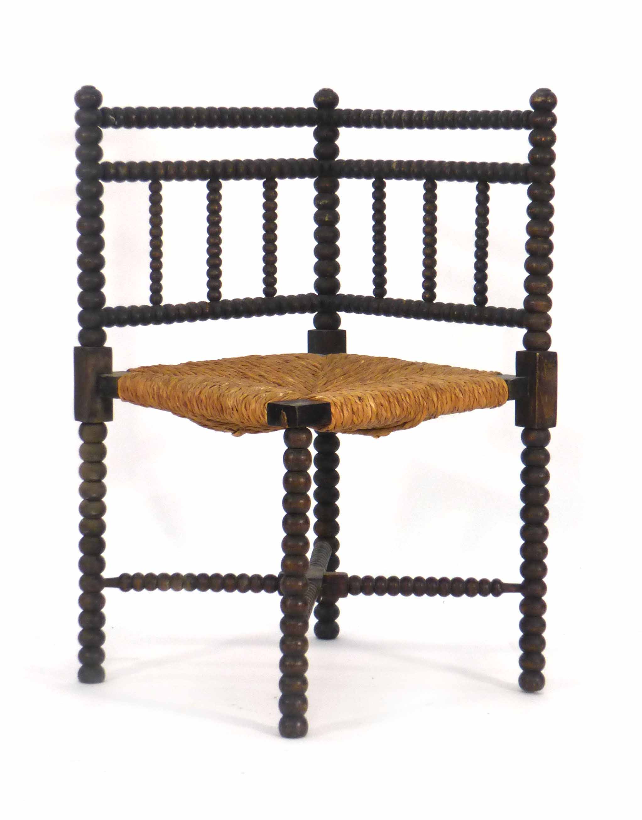 A late 19th/early 20th century bobbin turned corner chair CONDITION REPORT: Rickety, one spindle