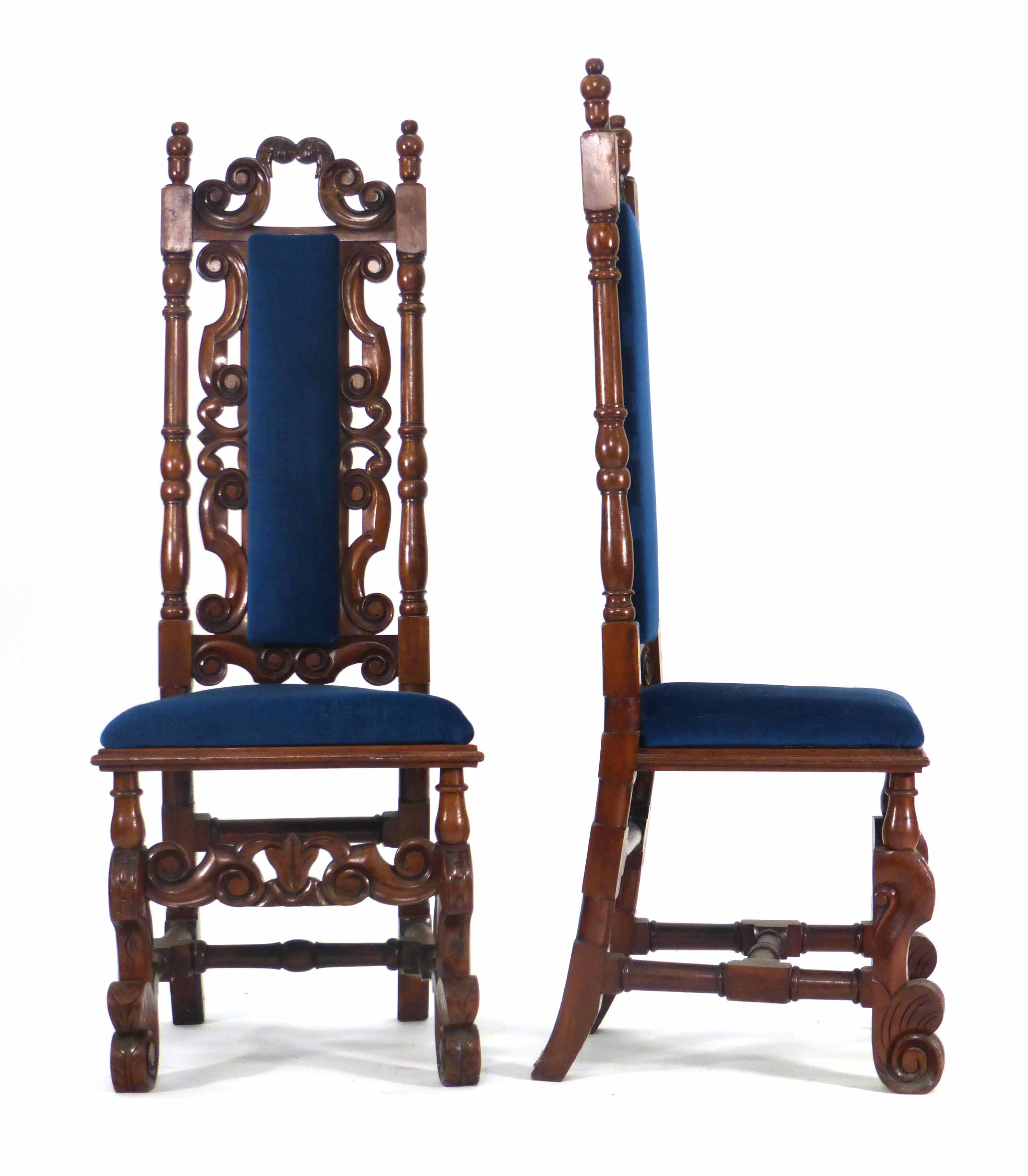 A pair of Victorian mahogany and upholstered hall chairs on figured supports joined by cross