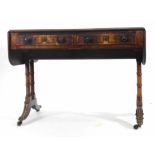 A Regency mahogany and inlaid drop leaf sofa table with two frieze drawers on two supports with four