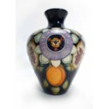 A Moorcroft trial vase of bulbous form, the poly chrome tube line design depicting fruits and