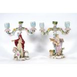 A pair of 18th century-style Continental porcelain figural candelabra modelled as ladies at work, h.
