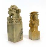 A 20th century carved soapstone figural seal with a glass marble contained within, h.