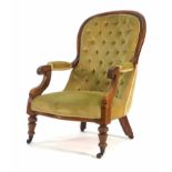 A Victorian mahogany and button upholstered open armchair on turned feet  CONDITION REPORT: Wear