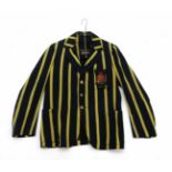 A vintage green and yellow striped Varsity blazer for U.N.C.W. (the former University College of