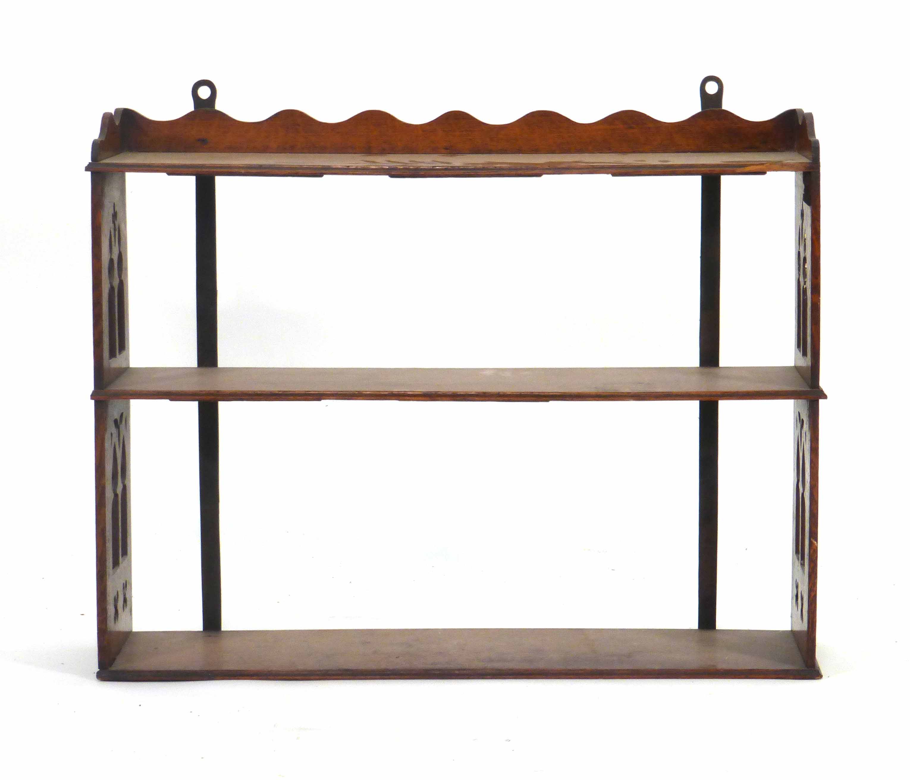 A late 19th century Gothic Revival oak three tier hanging wall shelf, l. 68 cm CONDITION REPORT: