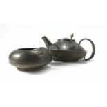 An Arts & Crafts pewter teapot of squat form by English Pewter, in the manner of Christopher