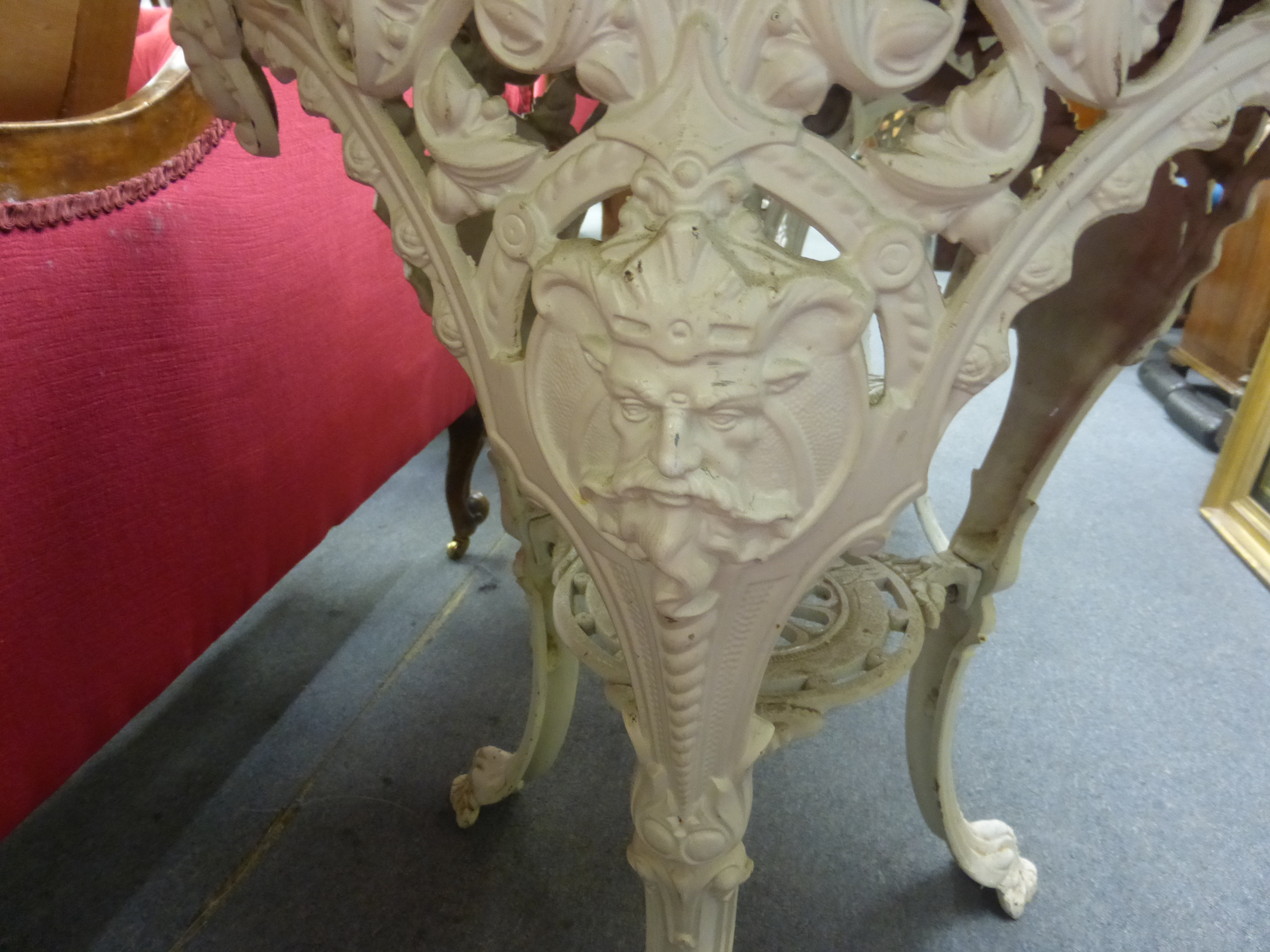 A late Victorian garden table, the mahogany circular top on a white cast iron base, the three legs - Image 4 of 15