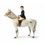 A Beswick figure of a female rider on a white horse, h. 22 cm CONDITION REPORT: Some losses to