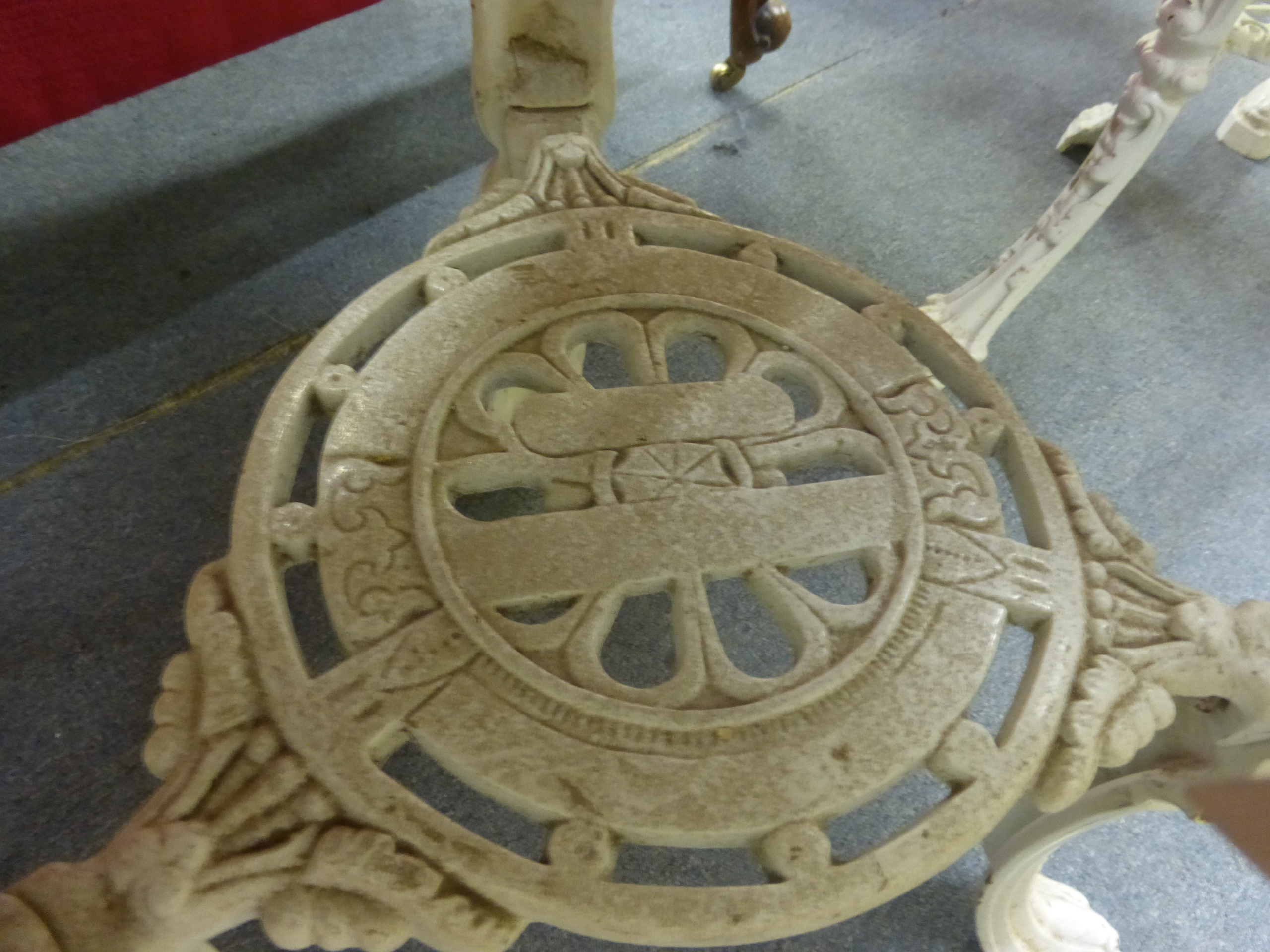 A late Victorian garden table, the mahogany circular top on a white cast iron base, the three legs - Image 2 of 15