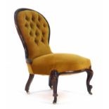 A Victorian mahogany and button upholstered nursing chair on scrolled feet CONDITION REPORT: Tired