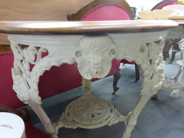 A late Victorian garden table, the mahogany circular top on a white cast iron base, the three legs - Image 11 of 15