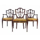 A set of three Sheraton-style mahogany open shield-back carver armchairs on square tapering legs