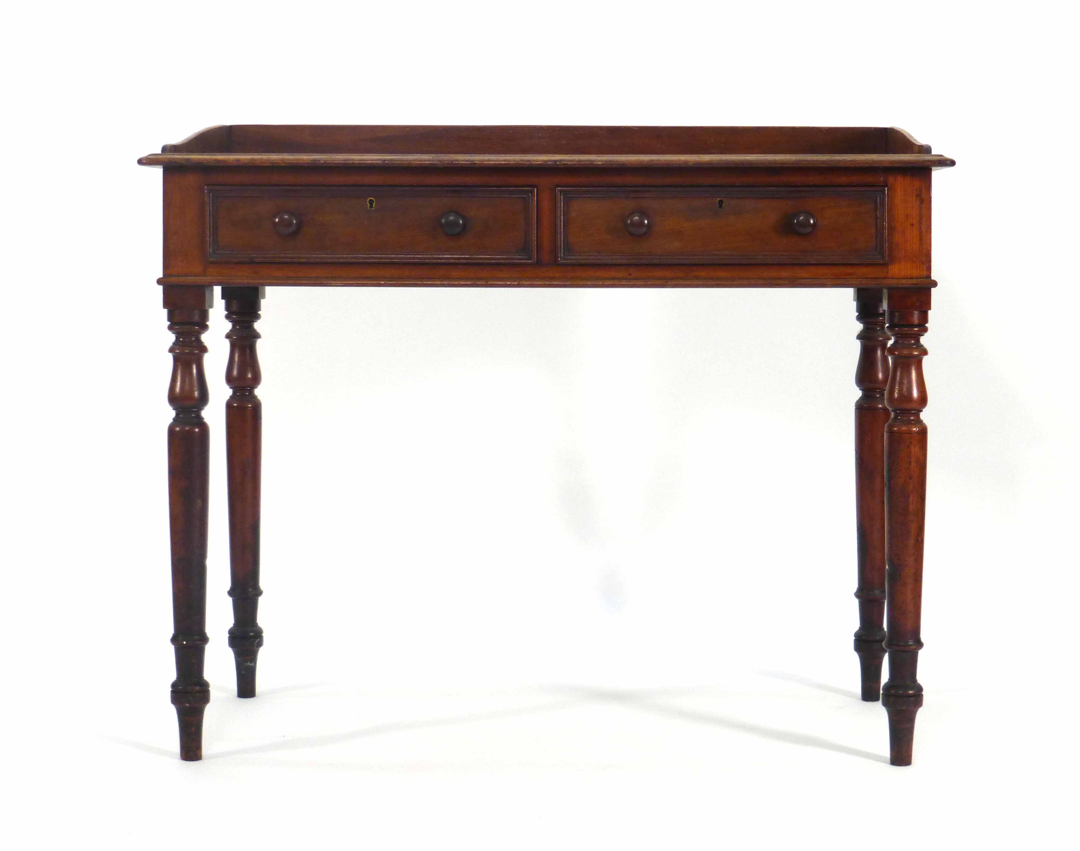 A Victorian mahogany writing table with two frieze drawers on turned legs, w. 91 cm CONDITION