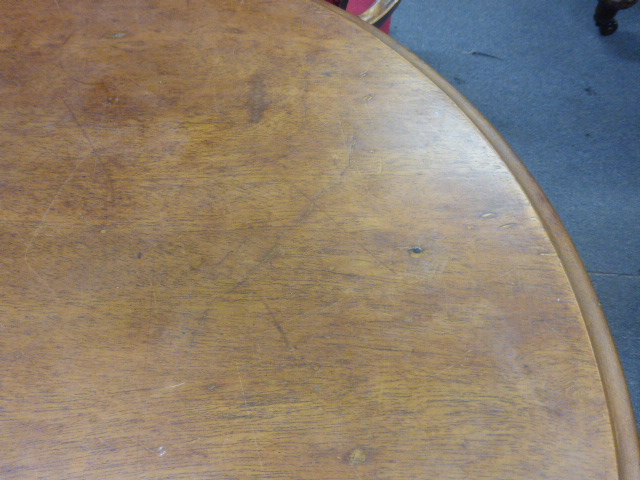 A late Victorian garden table, the mahogany circular top on a white cast iron base, the three legs - Image 8 of 10