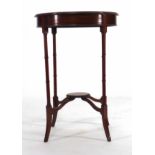 An Edwardian circular beech occasional table on four turned legs joined by a central platform, d. 50