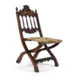 A late 19th/early 20th century beech folding campaign chair with barley twist splat and heavily
