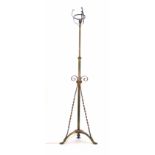 A 19th century brass and copper mounted adjustable scrolled standard lamp, in the manner of Benson