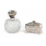 A silver mounted cut glass perfume bottle, Birmingham 1909, h. 15 cm, together with an oblong cut