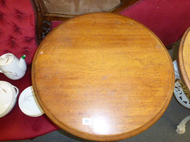 A late Victorian garden table, the mahogany circular top on a white cast iron base, the three legs - Image 15 of 15