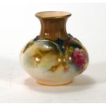 An early 20th century Worcester spill vase, hand decorated with flowers on a pale ground, pdcm 1905,