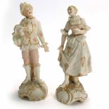 A pair of 19th century porcelain figures modelled as a dandy and his companion, h. 12 cm