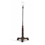 A 19th century turned rosewood polescreen stand, later converted to an electric standard lamp, on