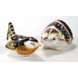 A Royal Crown Derby paperweight in the form on an ant eater, h. 6 cm, together with another