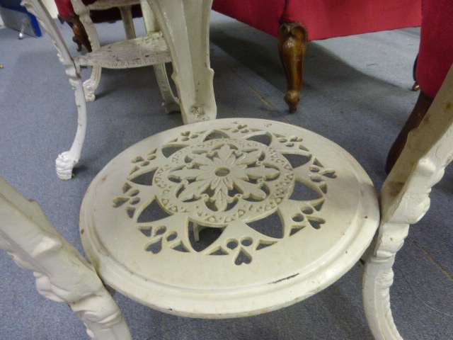 A late Victorian garden table, the mahogany circular top on a white cast iron base, the three legs - Image 4 of 10