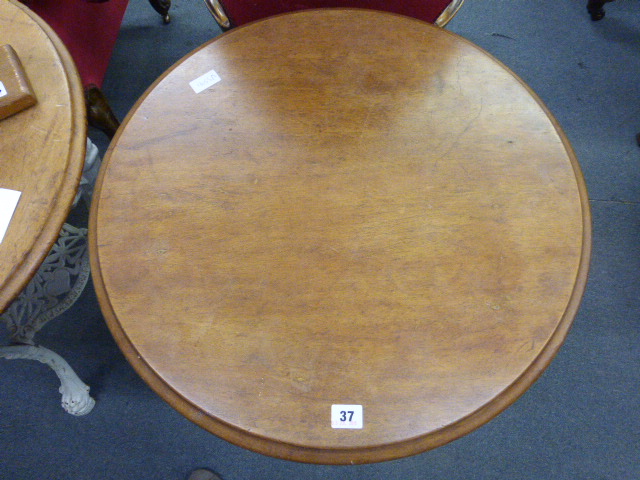 A late Victorian garden table, the mahogany circular top on a white cast iron base, the three legs - Image 10 of 10