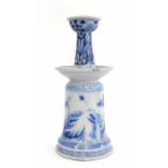 A 19th/20th century Chinese two tier vase of fountain form, decorated with blue swags and landscapes