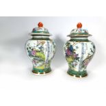 A pair of early 20th century Chinese vases and covers of baluster form,